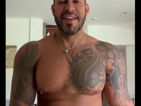 A tattooed gay bear porn star, Viktor Rom, has rough sex with a man in front of his wife.