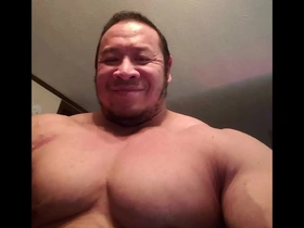 Young and lean Asian guy showing off his muscles