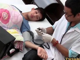 Gay couple has fun while one of them is being treated by a medic.