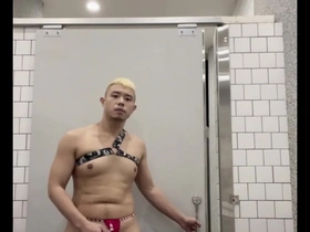 Gay muscle hunk goes naked and shows off his cock