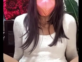 Femboy in a mask pleasuring himself while live streaming.