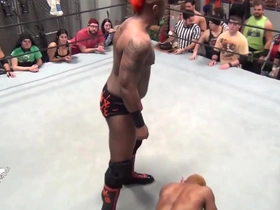 Black gay men engage in wrestling.