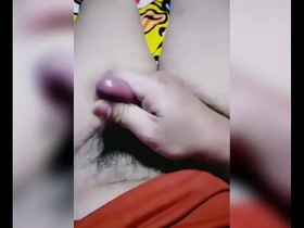 Young Asian man masturbates and ejaculates.