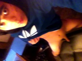 A skinny teen with an emo look and a blue Adidas hoodie masturbates.