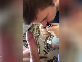 Young gay man gives deep blow job to his partner