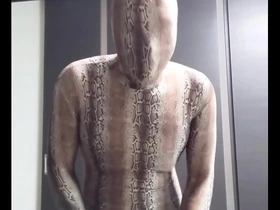 Solo boy in zentai, full body spandex, masturbates in front of camera.