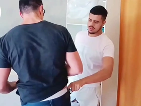 Amateur gay gives blowjob to a customer in the laundry room