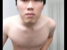 Pretty Asian boy masturbating.