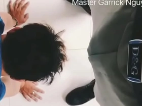 An Asian man is dominated by his superior in the office.