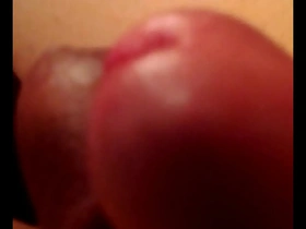 Two gay men masturbate together.