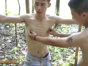 Asian boy tied up and abused outdoors in woodland