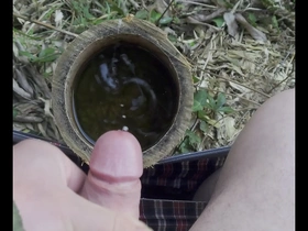 Gay Japanese man masturbates outdoors in public.